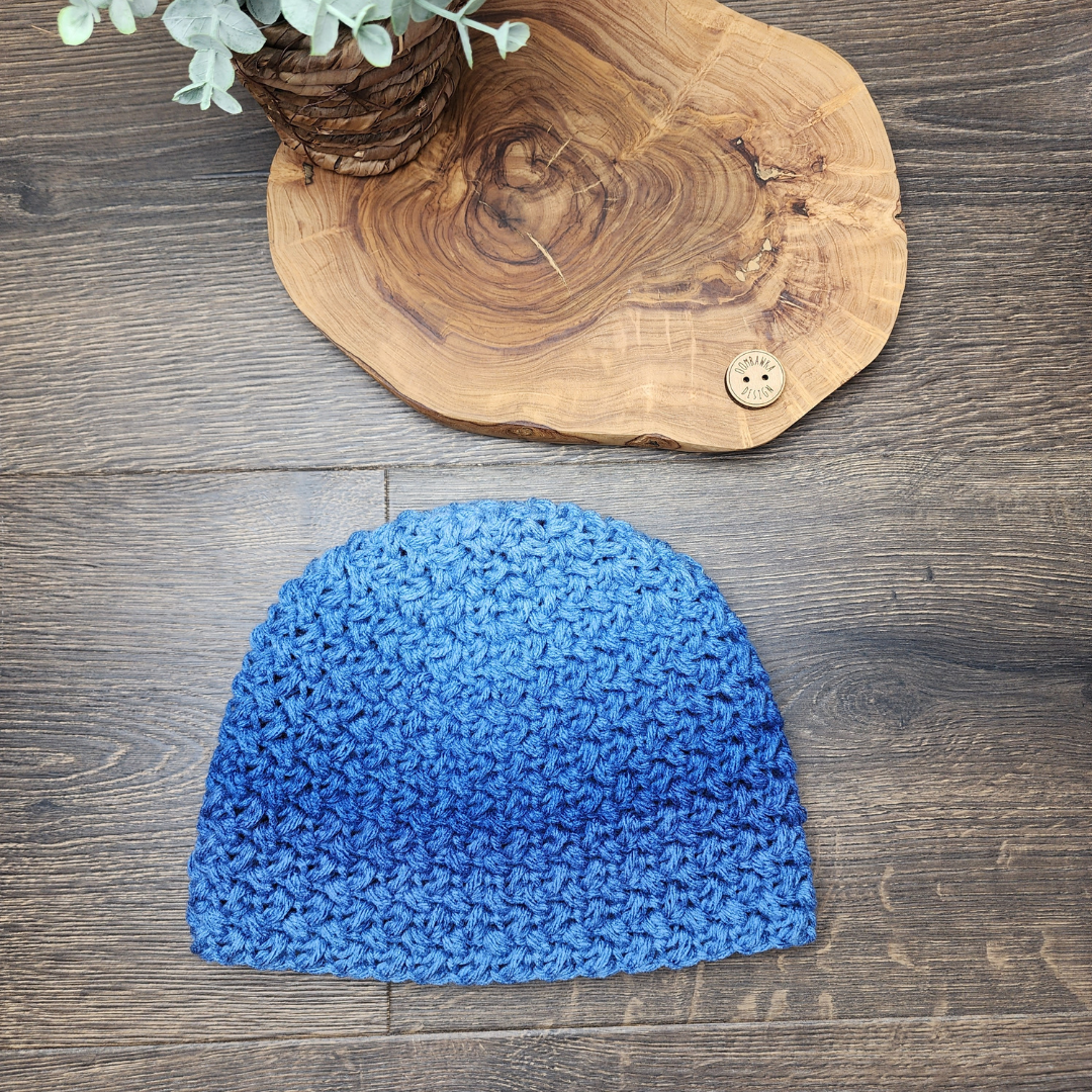 Create a cozy and stylish hat with the popular Baby Bean Stitch. This top-down crochet pattern includes sizes from baby to adult large, with a matching scarf option. Get the free pattern or an ad-free copy from our shop. Easy crochet hat pattern made with Red Heart Super Saver Ombre Yarn. #yarnspirations #redheartyarns #hatofthemonth #scarfofthemonth #elizabethstitch #babybeanstitch #puffstitch
