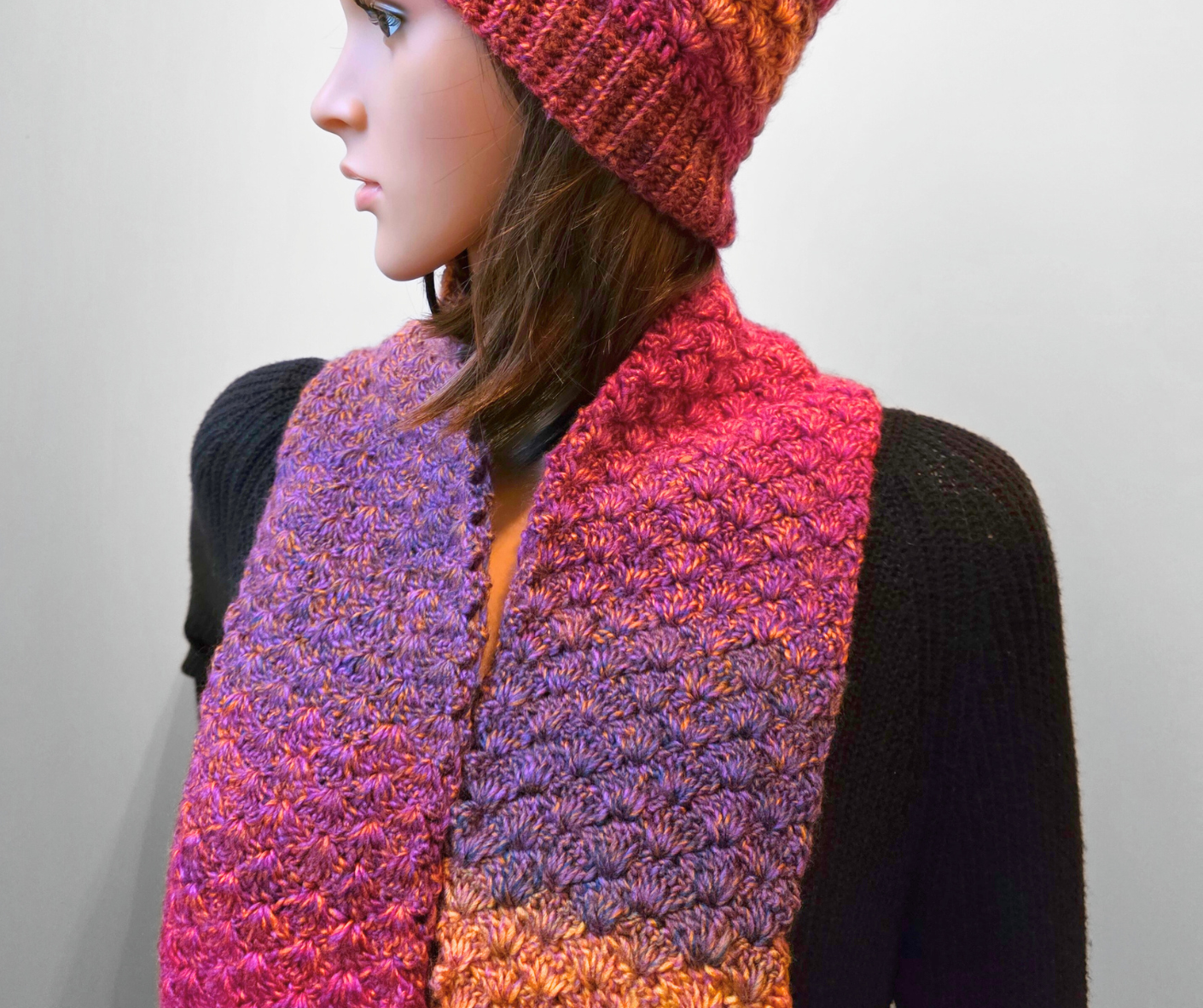 Crochet the Fanfare Scarf with just one ball of variegated yarn (Color: Parrot) and a 4 mm (G) crochet hook. This easy-to-make scarf measures 5.25" wide by 55" long and is perfect for fall layering. You can adjust the width and length using the stitch multiple. Designed to pair with the matching Fanfare Hat pattern.