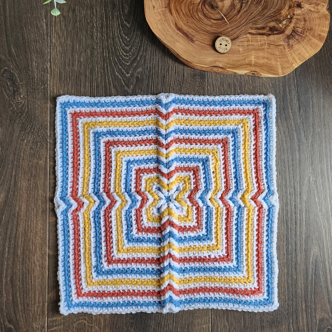 In the Middle Afghan Square Crochet Pattern. Designed by Rhondda Mol.