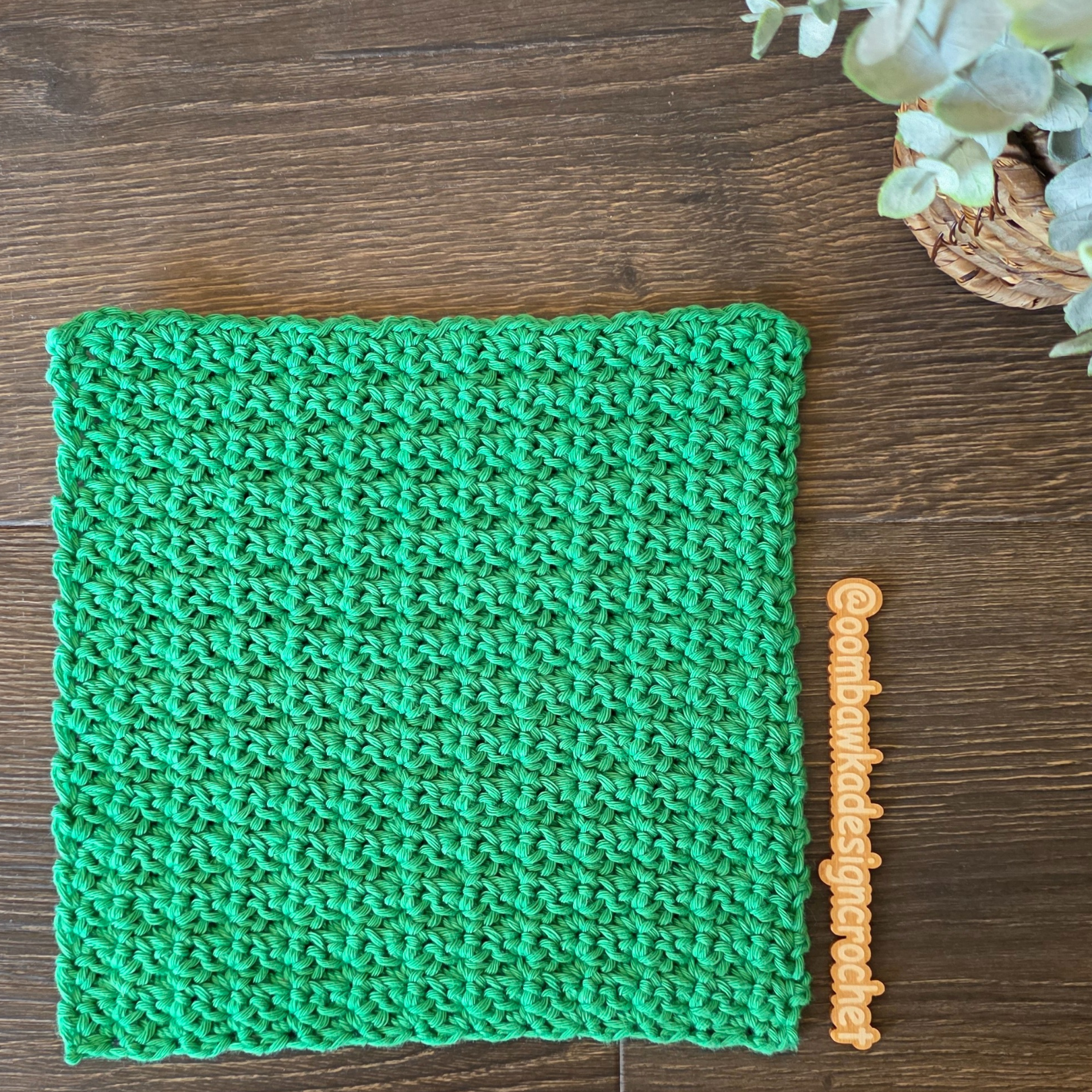 Green crochet Kitchen Dishcloth shown flat with textured stitches and neat edges.