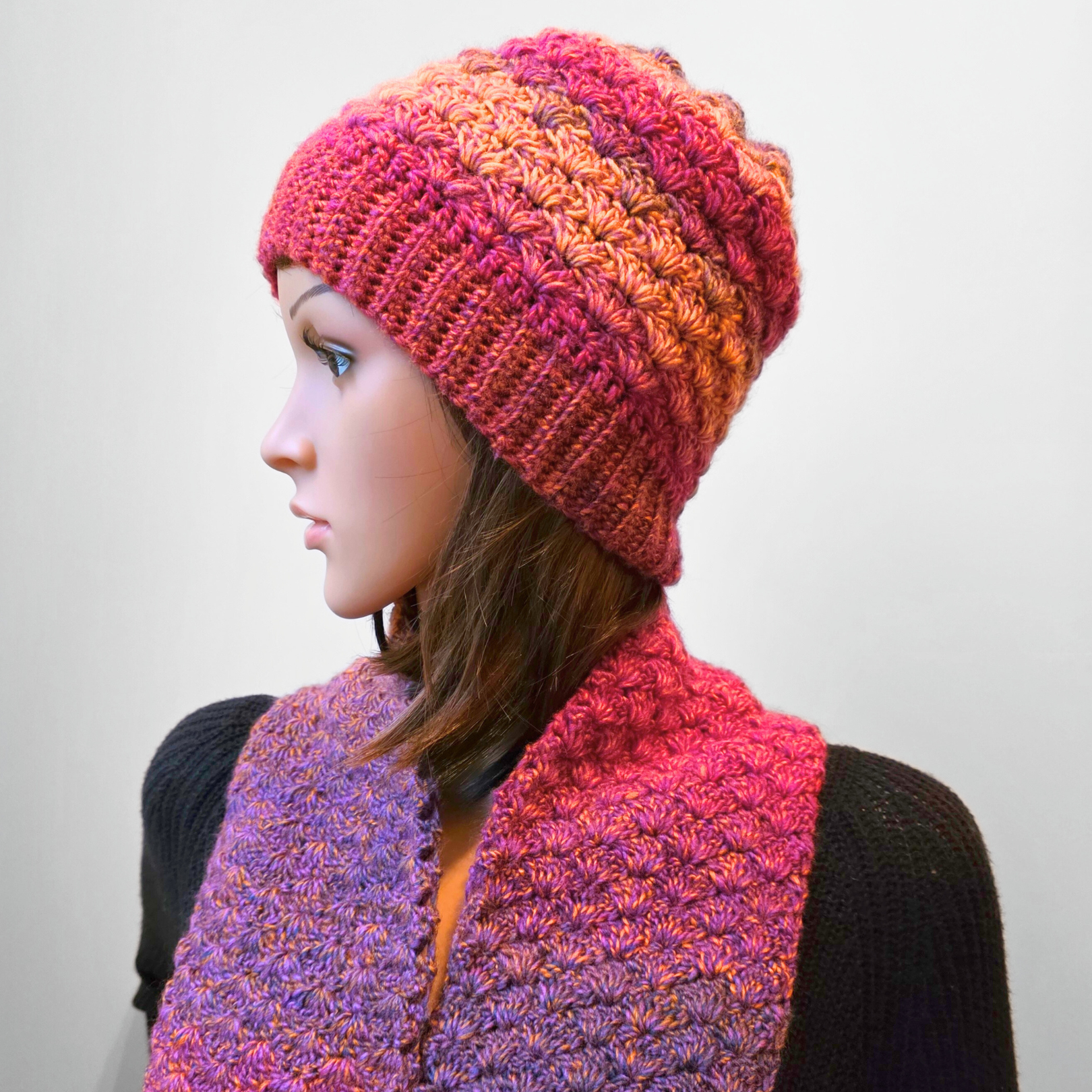 Crochet the Fanfare Hat and Scarf with just 1 ball of yarn! This bottom-up hat pattern includes sizes from baby to adult and works perfectly with variegated yarn. Free crochet pattern for the full set – easy to adjust for a slouchy fit.